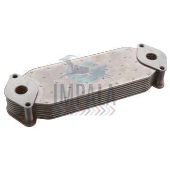 Scania DC13 engine oil cooler showing finned heat exchanger core with oil and coolant connection ports.
