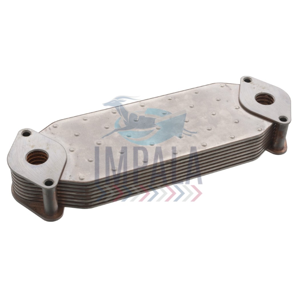 Scania DC13 engine oil cooler showing finned heat exchanger core with oil and coolant connection ports.